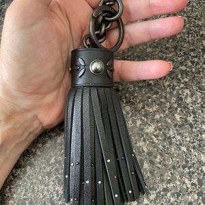 Beautiful Coach retail leather keychain with stud embellishments.